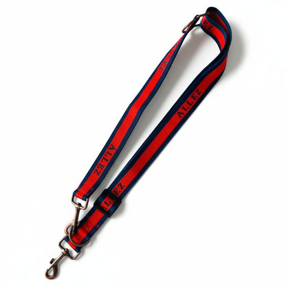 Allez red and navy blue Liberte dog lead in training mode. This dog lead converts easily from training mode to standard more. An adjustable length 2 in 1 one lead.